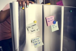 African descent woman open the fridge